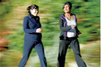 two pregnant women walking