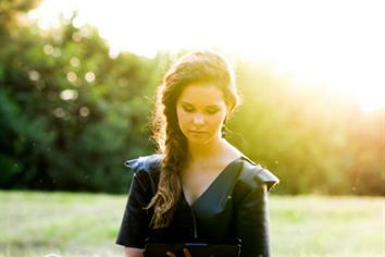 Young woman with digital tablet in nature